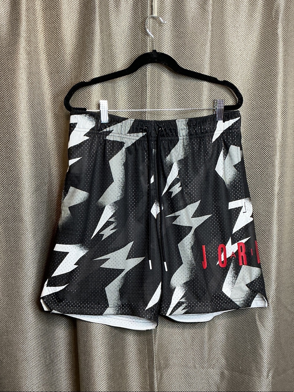 Jordan Men’s Black Athletic Shorts with Gray Lightning and Red Logo